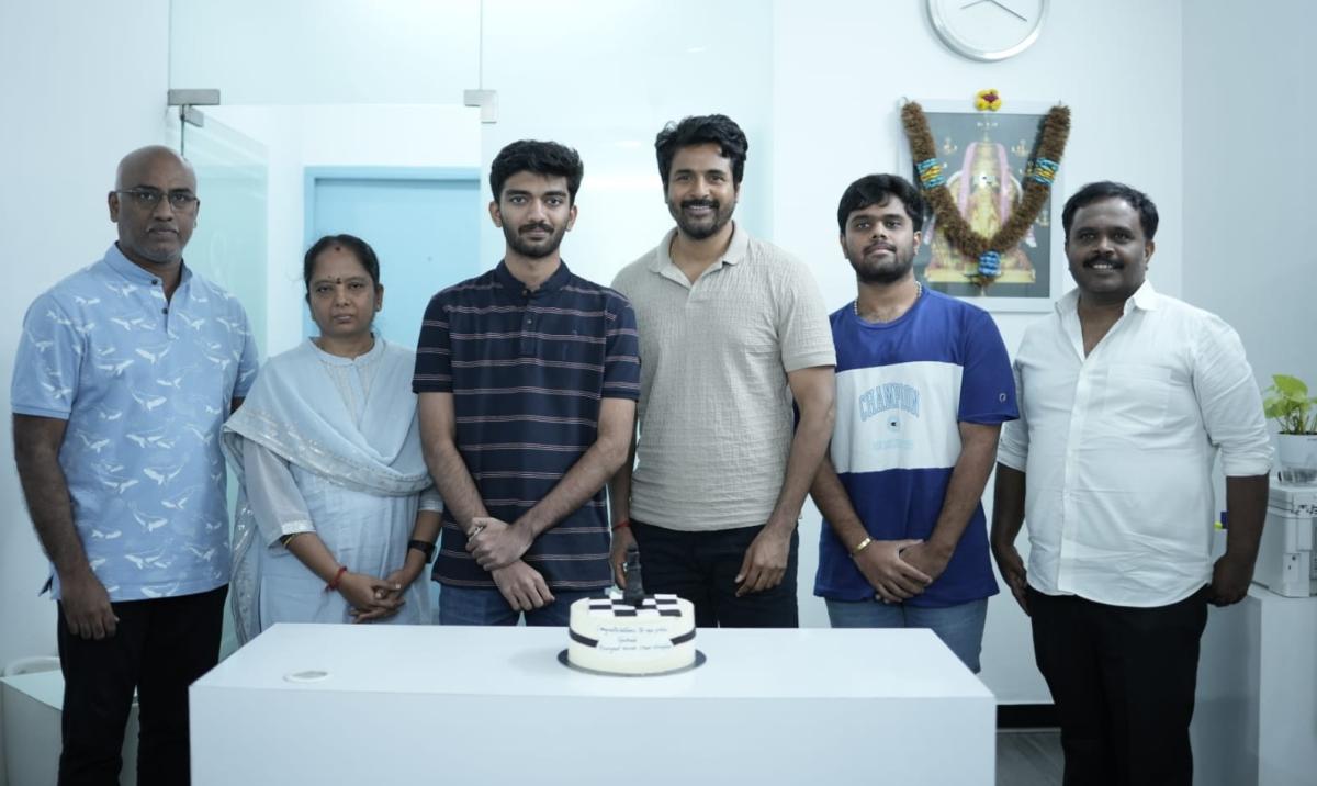 rajinikanth gifted a devotion book to chess champion gukesh